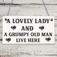 A Lovely Lady And A Grumpy Old Man Live Here Novelty Wooden Plaque Gift Sign