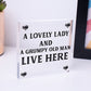 A Lovely Lady And A Grumpy Old Man Live Here Novelty Wooden Plaque Gift Sign